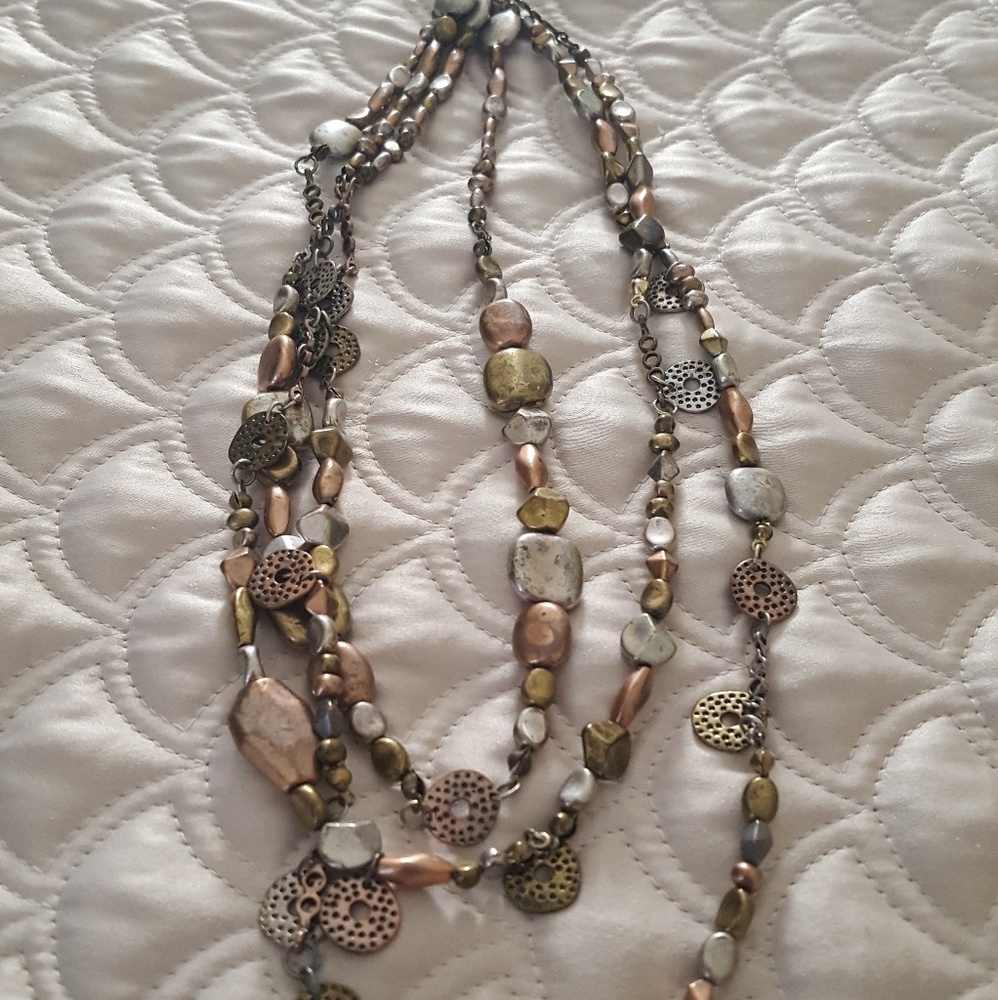 Multi strand earth tone necklace.